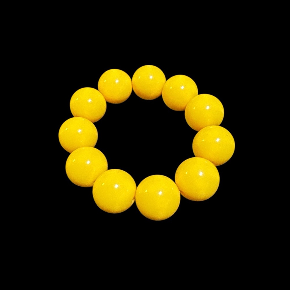 Fun chunky yellow plastic bead stretch bracelet. Beads are 3/4” wide.